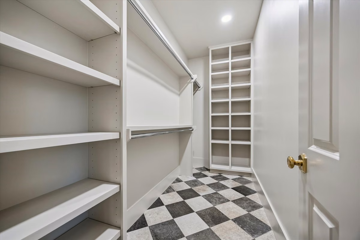The primary closet in the addition features built-ins. This is one of TWO walk in closets for the primary bedroom.