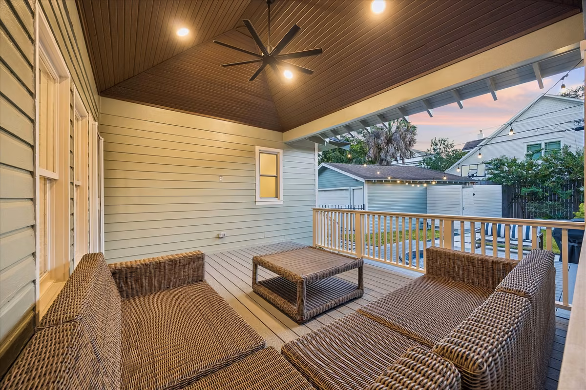 The covered back porch with view to your backyard oasis.