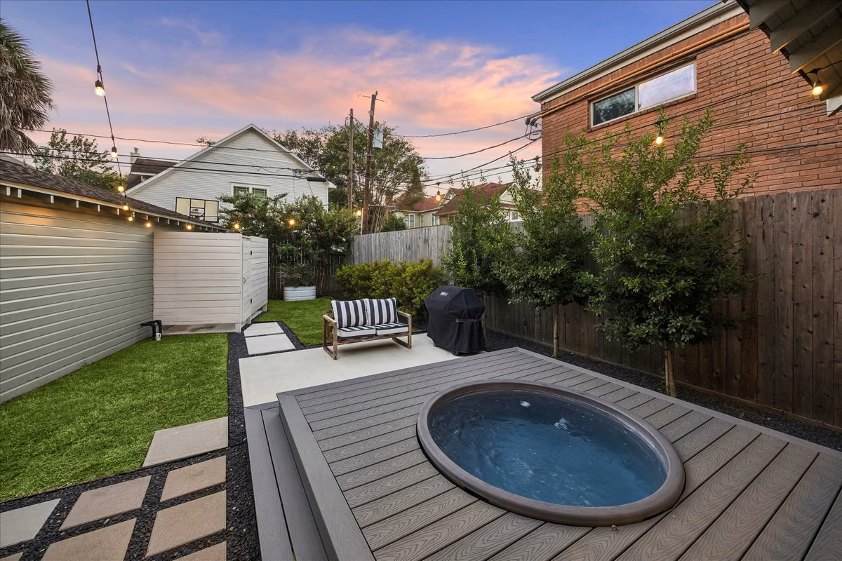 Meticulously landscaped, this backyard layout makes the most of the space with the extended porch featuring the above ground "cowboy pool" (with filter & temp control. All equipment conveys), as well as the outdoor shower.