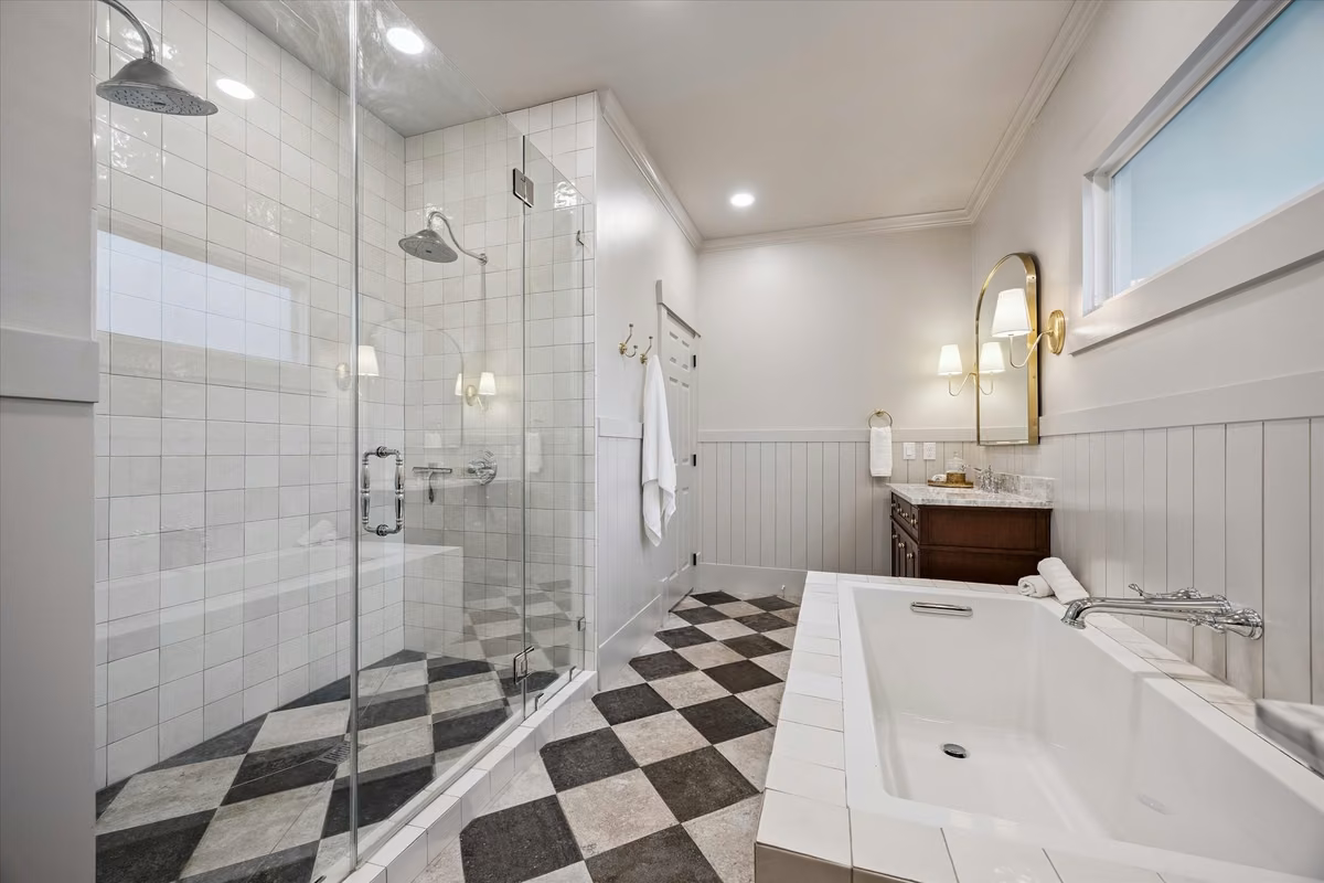 Amazing primary bath features dual shower head walk in shower; soaking tub; designer lighting; and dual vanities!