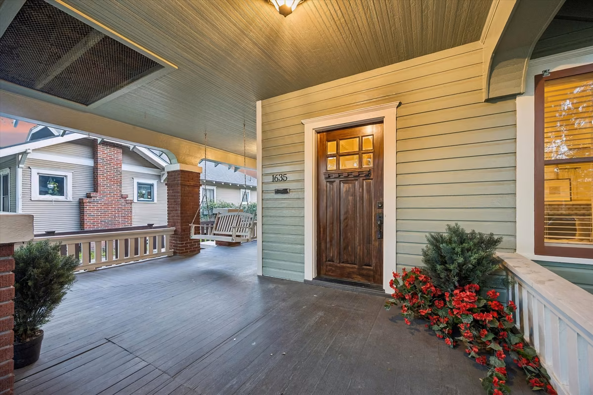 The expansive covered front porch with porch swing exudes Southern charm!