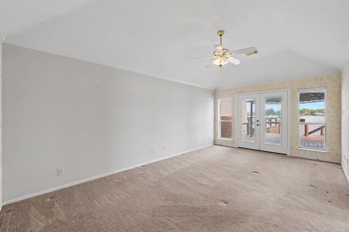 Spacious Primary Suite with French Doors leading to the deck.