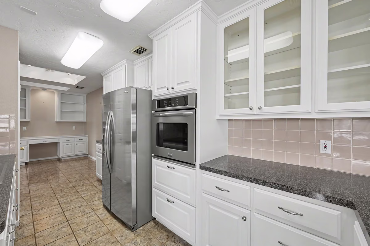 Kitchen opens to the Breakfast Area and office space.