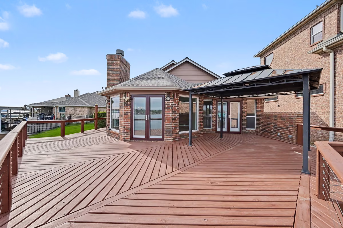 Expansive patio deck with multiple access points from the home. Covered portion is ideal for a large table or seating arrangement.