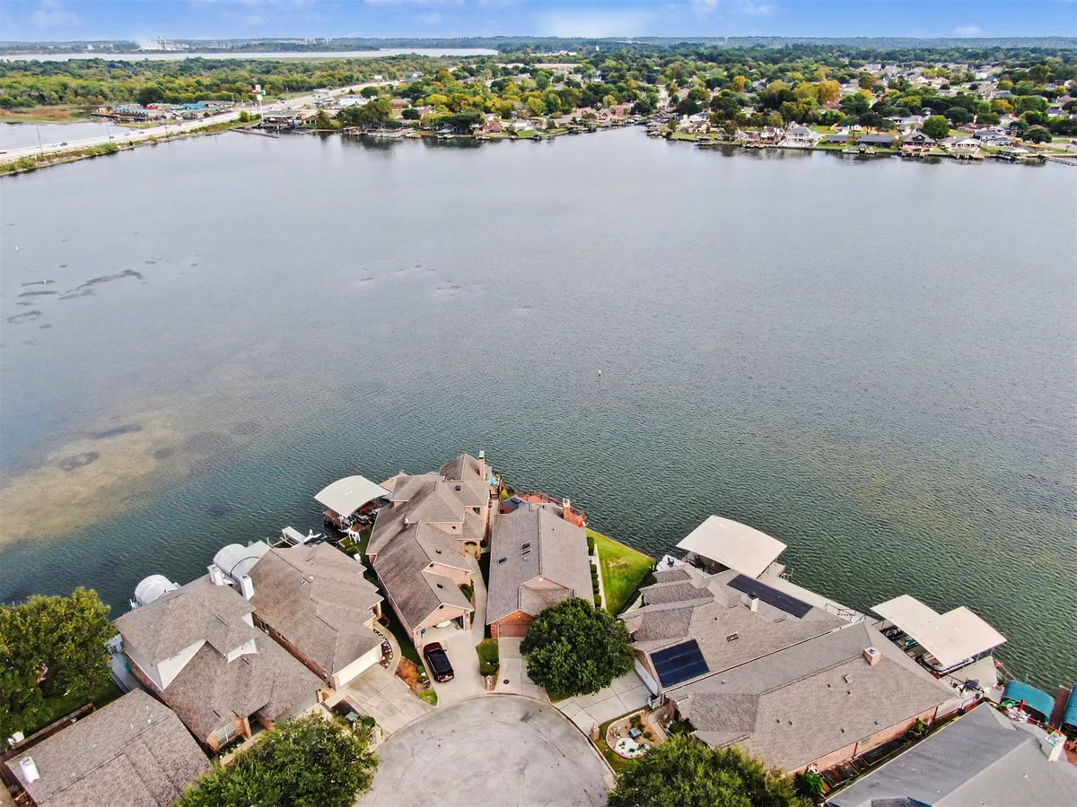 Additional Aerial View.  One might notice the sand bar around the island.  This helps protect the properties from boats traveling at high speeds.